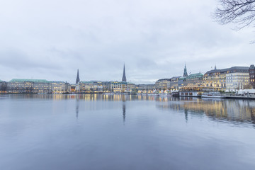 Fototapeta premium Serene cityscape landscape scene. Long exposure, blurry sea/rive