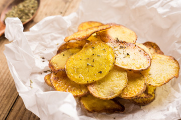 Homemade potato chips with spices