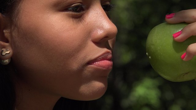 Female Child Eating an Apple