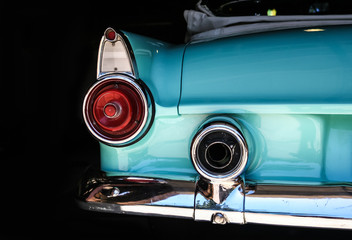 Chrome rear tail lights, bumper bar and exhaust of convertible aqua