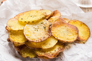 Homemade potato chips with spices