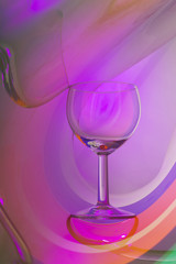 Wine glass on an abstract colored background
