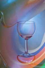 Wine glass on an abstract colored background