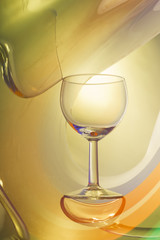 Wine glass on an abstract colored background