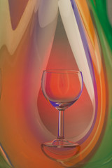 Wine glass on an abstract colored background