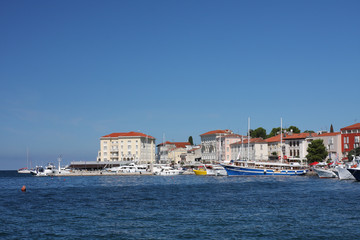Fototapeta na wymiar Tourist harbor in Porec in Croatia in the summer day.