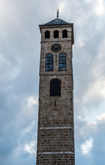 Fototapeta na wymiar Clock Tower next to Gazi Husrev-beg Mosque in Sarajevo, Bosnia and Herzegovina