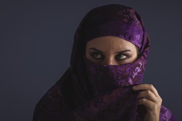 ethnic Beautiful arabic woman with traditional burqa veil