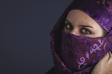 Beautiful arabic woman with traditional burqa veil