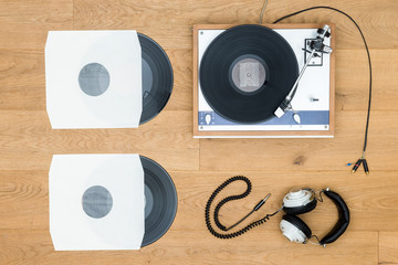 Vintage Turntable And Records On Wooden Table