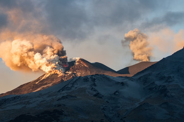 Volcano eruption. Mount Etna erupting from the crater Voragine
