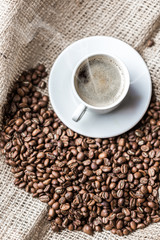 Coffee grains and coffee cup