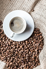 Coffee grains and coffee cup