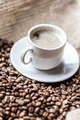 Coffee grains and coffee cup