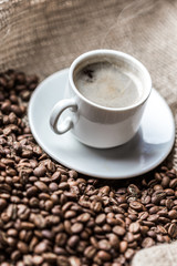 Coffee grains and coffee cup