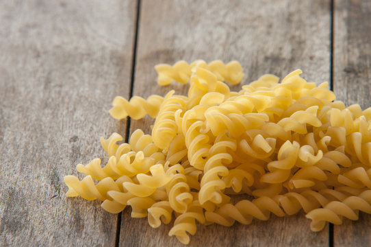 Raw pasta isolated on black (spiral shaped)