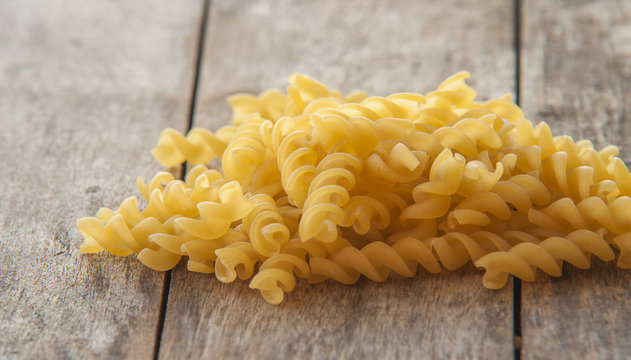 raw pasta isolated on black (spiral shaped)