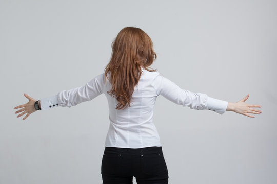 Woman Stands Back And Raised Her Arms To The Side