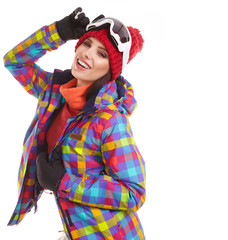 Young smiling woman is posing with ski goggles in studio, isolat