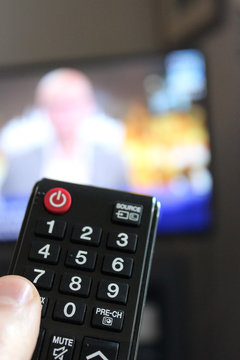 Television Remote Control in Human Hand