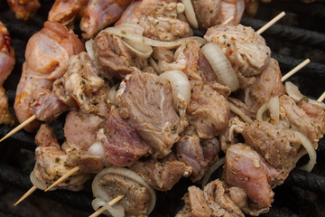 raw bbq meat prepared to grill on brazier