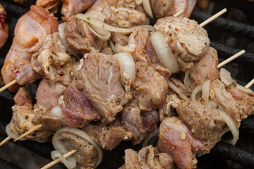 raw bbq meat prepared to grill on brazier