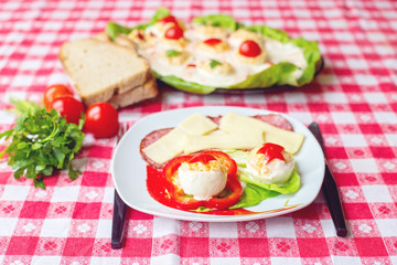 Deviled eggs appetizer with cheese and salami