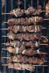 grilled bbq meat on stick on brazier 