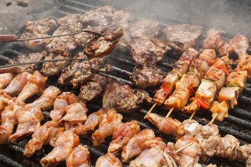 man hand  put bbq meat on grill