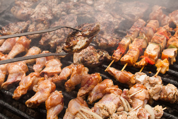 various meat chicken wings steaks grilled on brazier