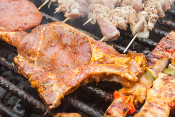 various meat chicken wings steaks grilled on brazier