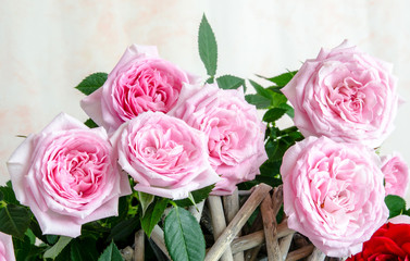 Bouquet of red roses with red wooden plank on table