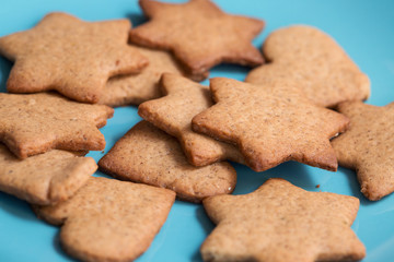 Tasty homemade cookies on blue plate