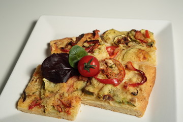 Elche coca vegetables on slate background
