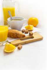 Croissants, coffee and orange juice. Breakfast concept. Space fo