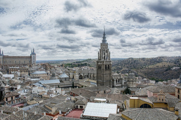Spire under the clouds in Toledo in Spain