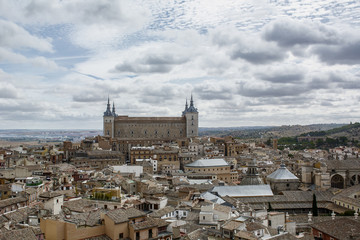 Fototapeta na wymiar Ancient buildings under the cloudy sky in Toledo in Spain