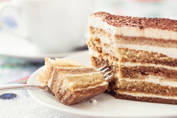 Tiramisu cake with cup of coffee