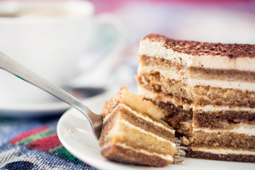 Tiramisu cake with cup of coffee