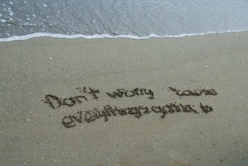 Fototapeta premium Escribir en la arena