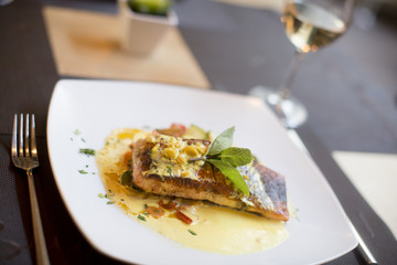 Grilled salmon with sauce and herbs