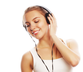 Woman with headphones listening music . Music teenager girl isol