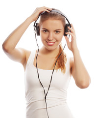 Woman with headphones listening music . Music teenager girl isol