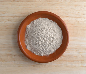Brown gravy dry mix in bowl on counter top