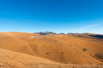Prealps of Veneto - Lessinia and Carega / Venetian prealps in the Regional Natural Park of Lessinia, Veneto, Verona, Italy. In the background the small Dolomites (Carega)