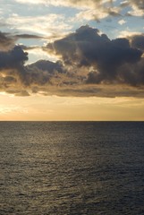 Dark cumulus clouds hovering over the sea