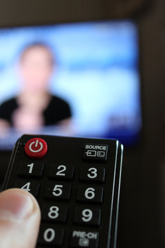 Television Remote Control in Human Hand