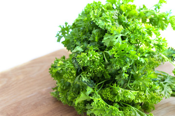 Fresh parsley on wooden cutting board