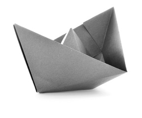 Black paper navigation origami sail boat isolated on white background