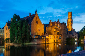Night scene of Rozenhoedkaai and Belfort Tower in Brugge Belgium